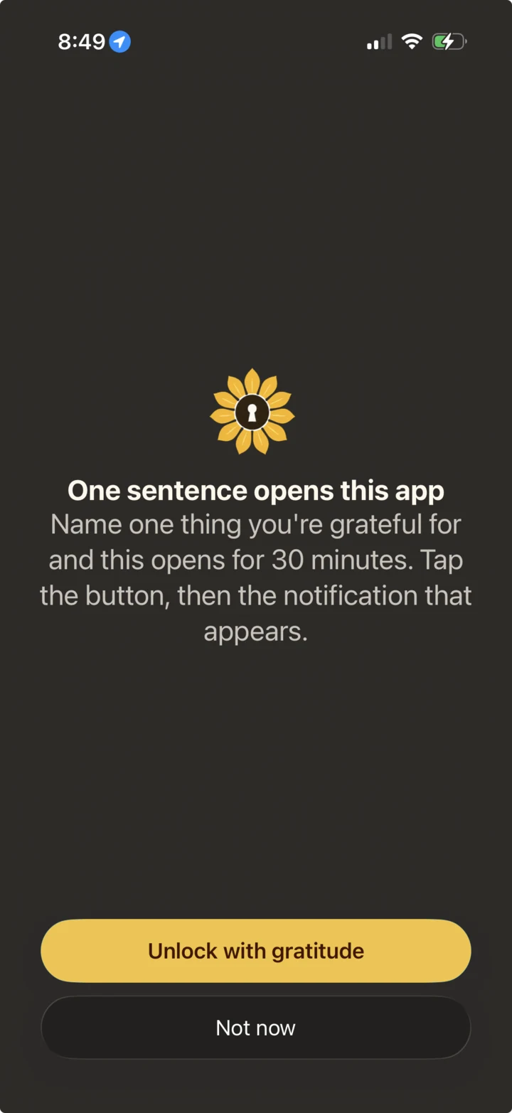 Gratlock pausing a blocked app until the user chooses to unlock it through gratitude
